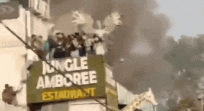 Watch: People jump off restaurant roof to escape fire in Delhi's Rajouri Garden | India News