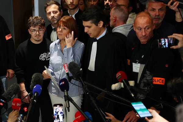 Frenchwoman Gisele Pelicot, the victim of an alleged mass rape orchestrated by her then-husband Dominique Pelicot at their home in the southern French town of Mazan, talks to journalists, surrounded by relatives and her lawyers, after the verdict in the trial for Dominique Pelicot and 50 co-accused, at the courthouse in Avignon, France, December 19, 2024. REUTERS/Manon Cruz Verdict at the Mazan mass rape trial in Avignon