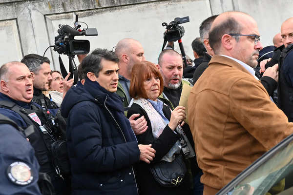 Frenchwoman Gisele Pelicot, the victim of an alleged mass rape orchestrated by her then-husband Dominique Pelicot at their home in the southern French town of Mazan, leaves the courthouse surrounded by French police after the verdict in the trial for Dominique Pelicot and 50 co-accused, in Avignon, France, December 19, 2024. REUTERS/Alexandre Dimou Verdict at the Mazan mass rape trial in Avignon