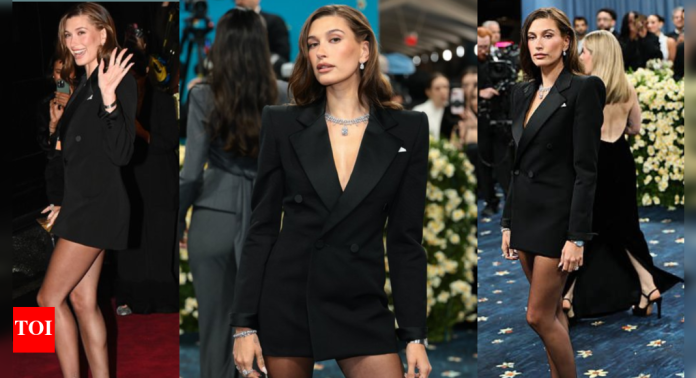 Hailey Bieber walks the 2025 Met Gala carpet without Justin Bieber in a bold micro blazer dress